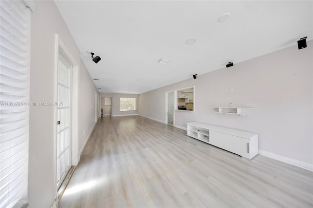 5781 SW 25th St, Miami, FL 33155 - unfurnished living room with light wood-type flooring