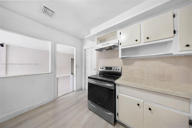 5781 SW 25th St, Miami, FL 33155 - kitchen featuring electric stove, under cabinet range hood, open shelves, light wood-style floors, and tasteful backsplash