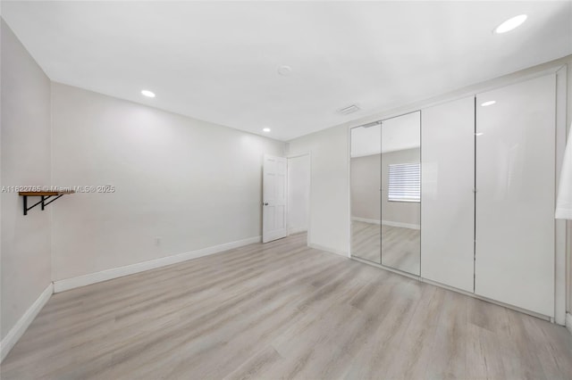 5781 SW 25th St, Miami, FL 33155 - unfurnished bedroom with light wood-type flooring, a closet, and recessed lighting