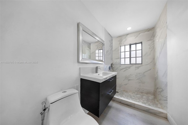5781 SW 25th St, Miami, FL 33155 - bathroom featuring vanity, a marble finish shower, and wood finished floors