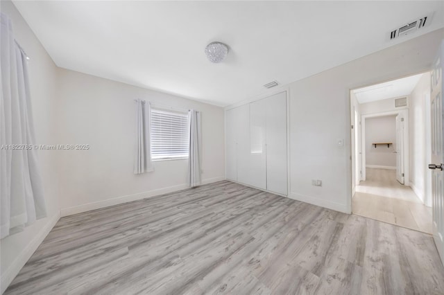 5781 SW 25th St, Miami, FL 33155 - unfurnished bedroom featuring wood finished floors and a closet