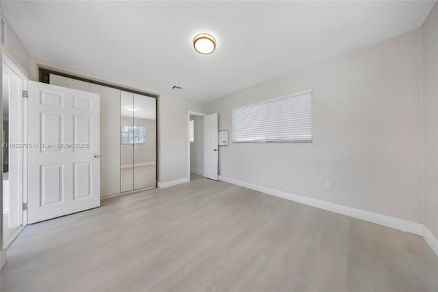 5781 SW 25th St, Miami, FL 33155 - unfurnished bedroom featuring light wood-style flooring and a closet