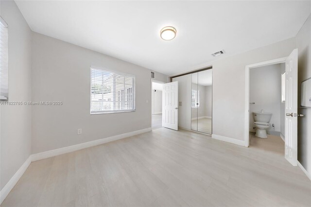 5781 SW 25th St, Miami, FL 33155 - unfurnished bedroom with light wood-type flooring and a closet