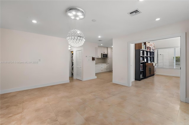 1601 Bay Rd Unit 4, Miami Beach, FL 33139 - unfurnished living room with a chandelier, recessed lighting, and light tile patterned floors