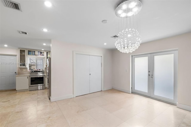 1601 Bay Rd Unit 4, Miami Beach, FL 33139 - unfurnished dining area with french doors, recessed lighting, and a chandelier
