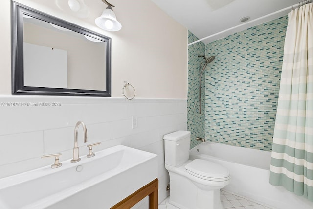 1601 Bay Rd Unit 4, Miami Beach, FL 33139 - full bath featuring shower / tub combo with curtain, vanity, tile patterned flooring, tile walls, and wainscoting