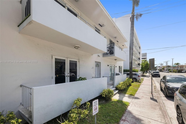 1601 Bay Rd Unit 4, Miami Beach, FL 33139 - view of home's exterior featuring french doors and stucco siding