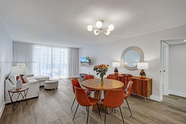 600 Three Islands Blvd Unit 615, Hallandale Beach, FL 33009 - dining space with wood finished floors and a chandelier