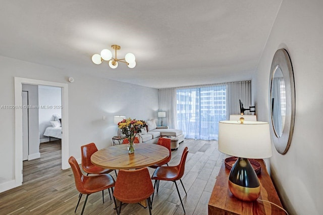 600 Three Islands Blvd Unit 615, Hallandale Beach, FL 33009 - dining area with wood finished floors and a chandelier