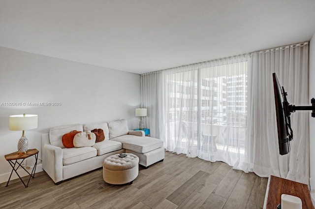 600 Three Islands Blvd Unit 615, Hallandale Beach, FL 33009 - living room featuring wood finished floors