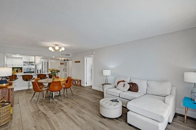 600 Three Islands Blvd Unit 615, Hallandale Beach, FL 33009 - living room featuring light wood-style floors and baseboards