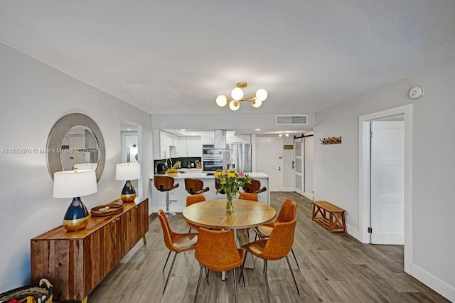 600 Three Islands Blvd Unit 615, Hallandale Beach, FL 33009 - dining area featuring wood finished floors