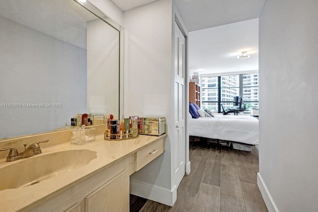 600 Three Islands Blvd Unit 615, Hallandale Beach, FL 33009 - ensuite bathroom with vanity and wood finished floors