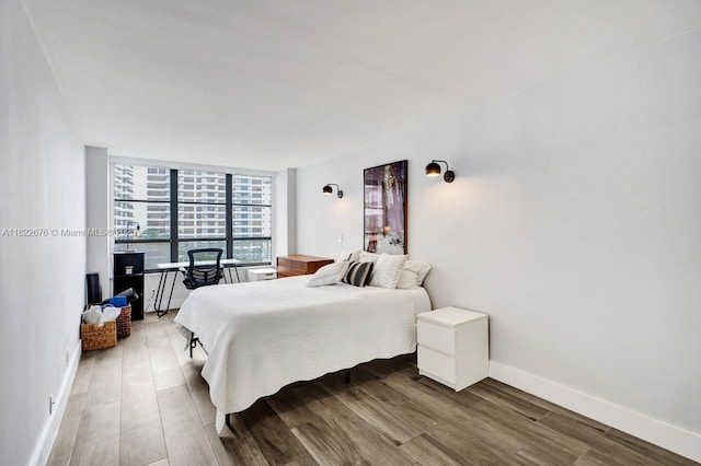 600 Three Islands Blvd Unit 615, Hallandale Beach, FL 33009 - bedroom with wood finished floors and a wall of windows