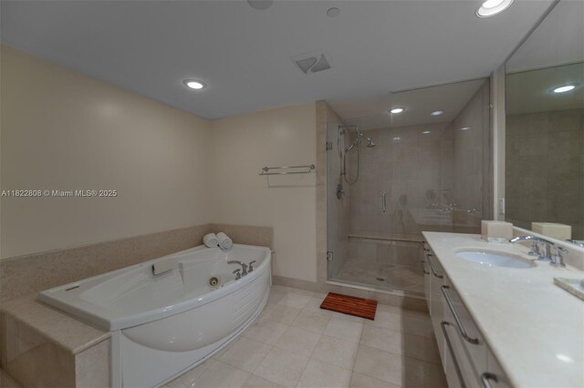 3101 S Ocean Dr Unit 404, Hollywood, FL 33019 - full bathroom featuring vanity, a jetted tub, a stall shower, tile patterned floors, and recessed lighting