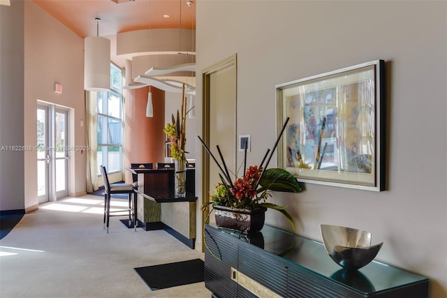 3101 S Ocean Dr Unit 404, Hollywood, FL 33019 - hall with a towering ceiling, healthy amount of natural light, and carpet floors