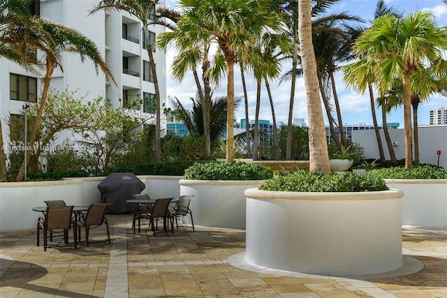 3101 S Ocean Dr Unit 404, Hollywood, FL 33019 - view of patio with a grill and outdoor dining space