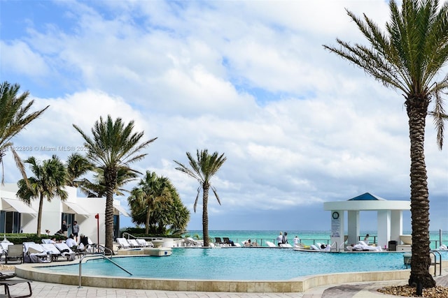 3101 S Ocean Dr Unit 404, Hollywood, FL 33019 - community pool with a water view and a patio area
