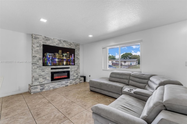 27645 SW 163rd Ave, Homestead, FL 33031 - living room with a stone fireplace, a textured ceiling, and light tile patterned floors