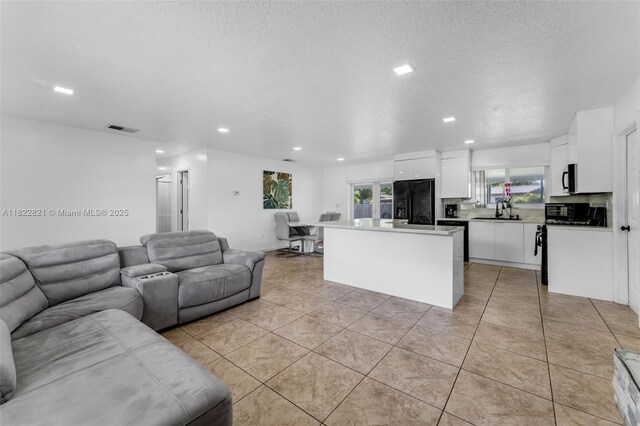 27645 SW 163rd Ave, Homestead, FL 33031 - living area with recessed lighting, light tile patterned flooring, and a textured ceiling