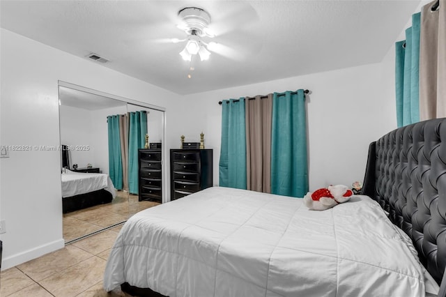 27645 SW 163rd Ave, Homestead, FL 33031 - tiled bedroom featuring a closet, a ceiling fan, and a textured ceiling