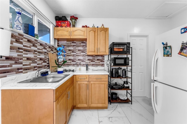 27645 SW 163rd Ave, Homestead, FL 33031 - kitchen featuring freestanding refrigerator, black microwave, light countertops, and light marble finish flooring