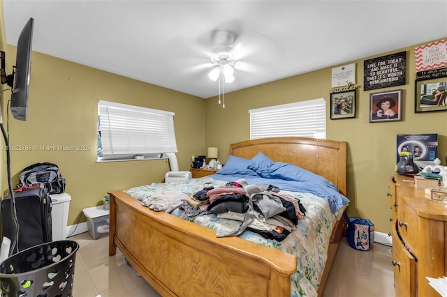 28540 SW 146th Ave, Homestead, FL 33033 - bedroom featuring ceiling fan, a baseboard radiator, and light tile patterned flooring