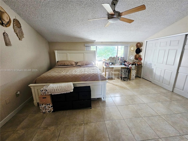 8401 W Sample Rd Unit 10, Coral Springs, FL 33065 - bedroom featuring a textured ceiling, vaulted ceiling, light tile patterned flooring, and a ceiling fan