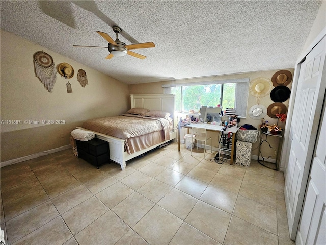 8401 W Sample Rd Unit 10, Coral Springs, FL 33065 - bedroom with a textured ceiling, light tile patterned floors, and a ceiling fan