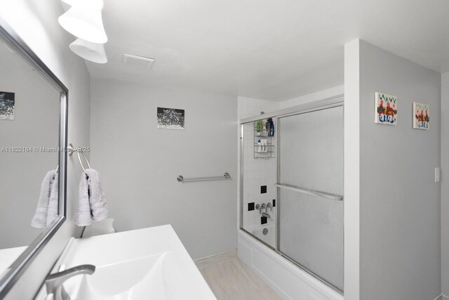 100 Golden Isles Dr Unit 101, Hallandale Beach, FL 33009 - bathroom with enclosed tub / shower combo