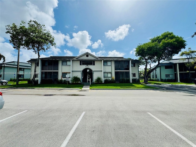 20731 NE 4th Pl Unit 103, Miami, FL 33179 - view of property featuring uncovered parking