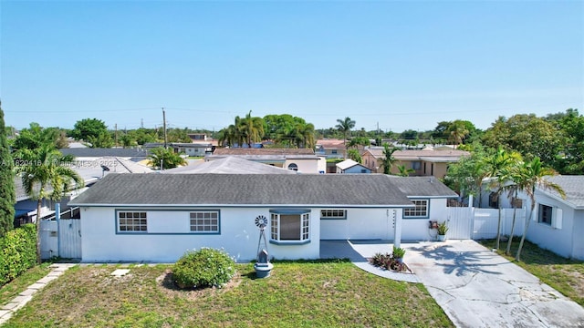 7950 NW 174th Ter, Hialeah, FL 33015 - ranch-style home with a gate, concrete driveway, and stucco siding