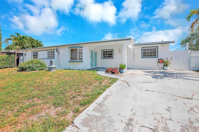 7950 NW 174th Ter, Hialeah, FL 33015 - single story home featuring stucco siding, driveway, and french doors