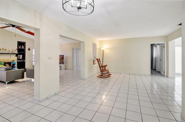 7950 NW 174th Ter, Hialeah, FL 33015 - unfurnished room featuring ceiling fan, light tile patterned flooring, and a chandelier