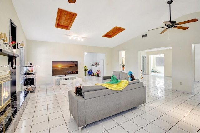7950 NW 174th Ter, Hialeah, FL 33015 - living room featuring light tile patterned floors, vaulted ceiling, and ceiling fan