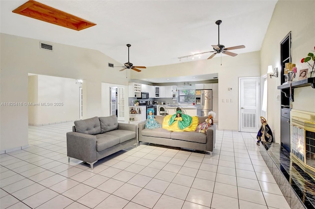 7950 NW 174th Ter, Hialeah, FL 33015 - living room with a ceiling fan, light tile patterned floors, and high vaulted ceiling