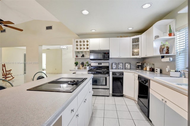 7950 NW 174th Ter, Hialeah, FL 33015 - kitchen with open shelves, black appliances, a ceiling fan, light countertops, and vaulted ceiling