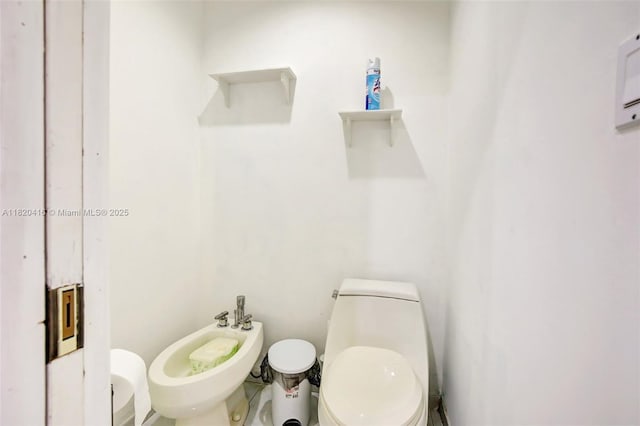 7950 NW 174th Ter, Hialeah, FL 33015 - bathroom featuring a bidet and toilet