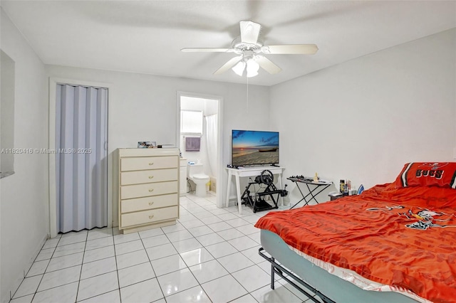 7950 NW 174th Ter, Hialeah, FL 33015 - bedroom featuring light tile patterned flooring, a ceiling fan, and ensuite bath