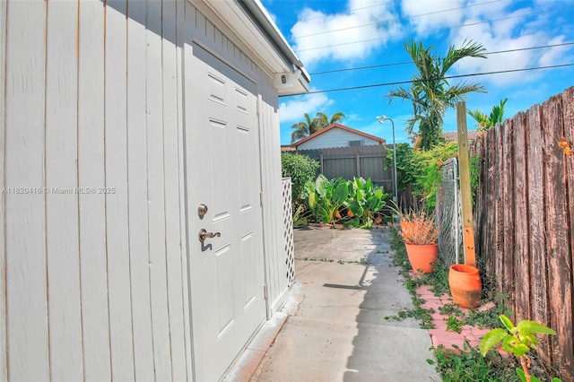 7950 NW 174th Ter, Hialeah, FL 33015 - view of exterior entry featuring a patio