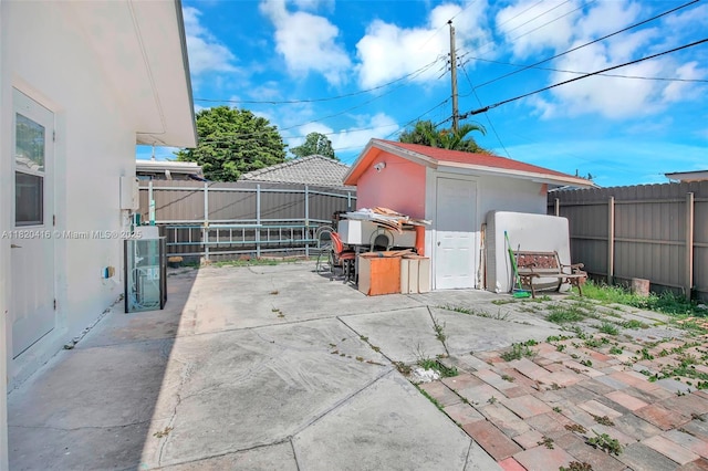 7950 NW 174th Ter, Hialeah, FL 33015 - fenced backyard with a patio and a storage unit