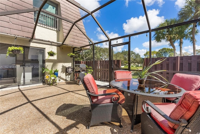 2571 NW 99th Ave, Coral Springs, FL 33065 - view of patio featuring outdoor dining space, area for grilling, and glass enclosure