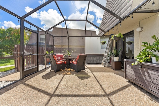 2571 NW 99th Ave, Coral Springs, FL 33065 - view of patio / terrace featuring glass enclosure and outdoor dining area