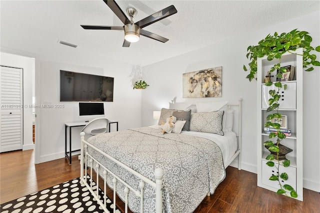 2571 NW 99th Ave, Coral Springs, FL 33065 - bedroom with dark wood-style flooring and a ceiling fan