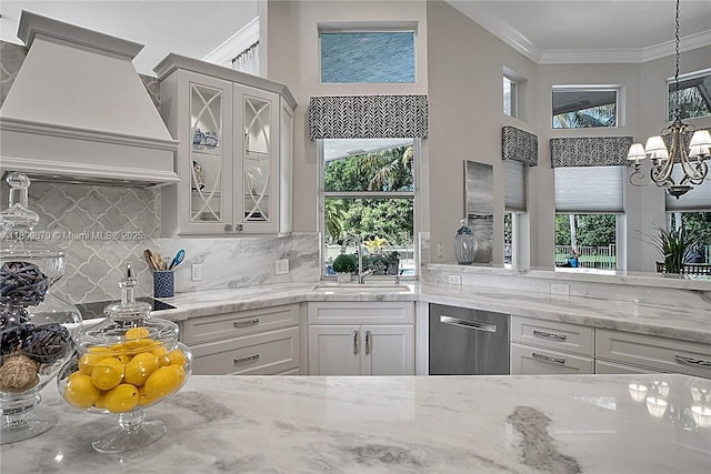 6807 NW 66th Way, Parkland, FL 33067 - kitchen featuring stainless steel dishwasher, custom exhaust hood, plenty of natural light, glass insert cabinets, and ornamental molding