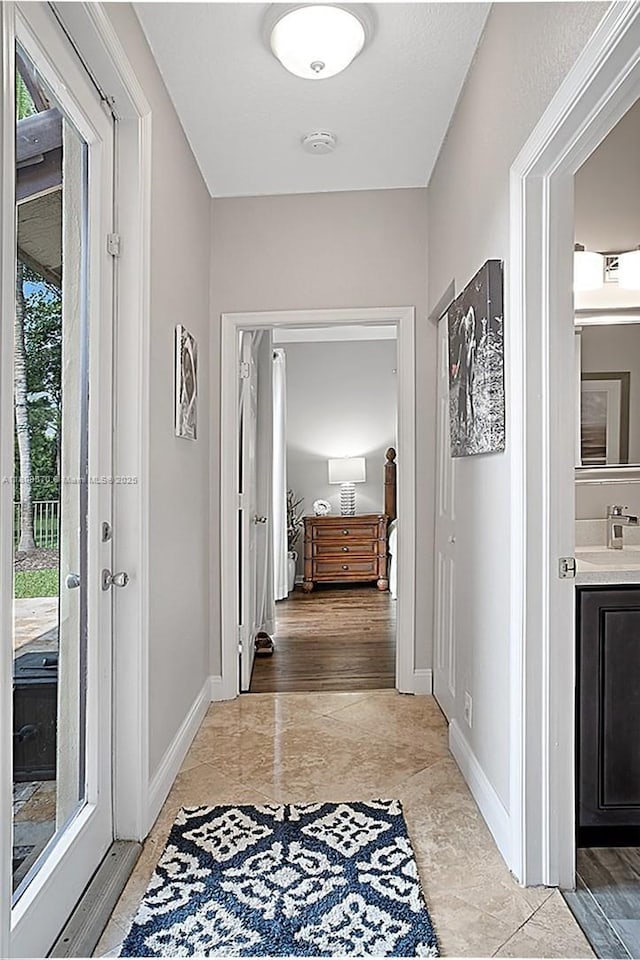 6807 NW 66th Way, Parkland, FL 33067 - hallway featuring baseboards
