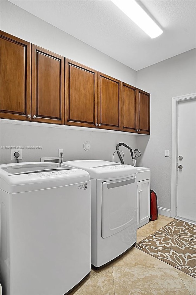 6807 NW 66th Way, Parkland, FL 33067 - laundry room featuring cabinet space, separate washer and dryer, and a textured ceiling