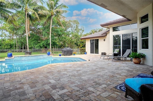 6807 NW 66th Way, Parkland, FL 33067 - view of swimming pool with a fenced backyard, a grill, and a patio