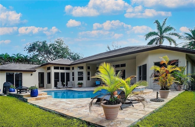 6807 NW 66th Way, Parkland, FL 33067 - rear view of property with a patio, stucco siding, and an outdoor pool