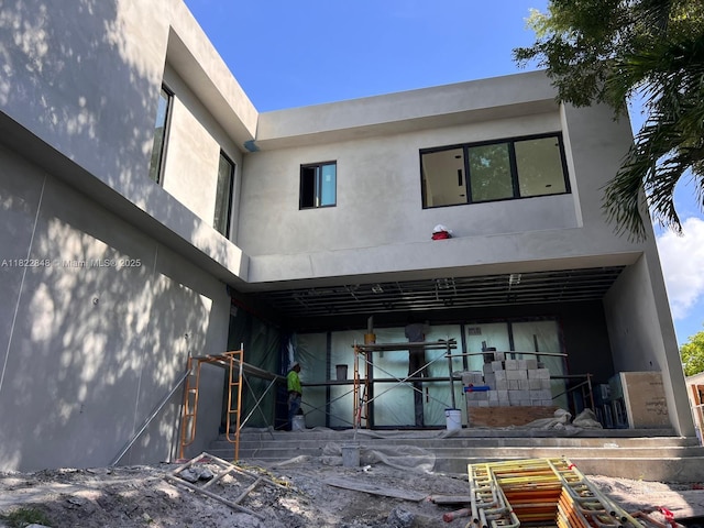 1700 NE 18th St, Fort Lauderdale, FL 33305 - rear view of house with stucco siding